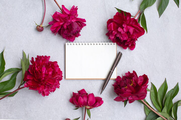 Peony flowers and Empty notebook for planning or wishing