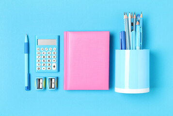 Different stationery on light blue background, flat lay. Back to school