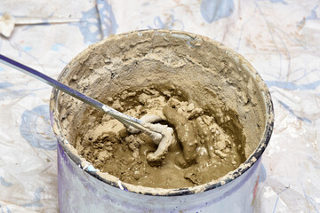 mixing the solution in container. construction, repair