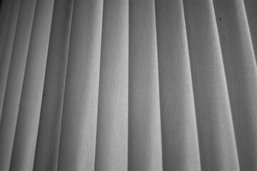 evocative image of black and white texture of verical striped canvas
