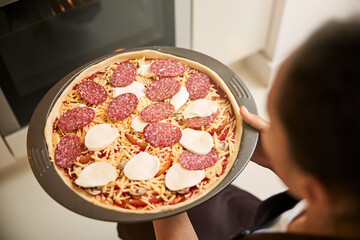 Final stage of cooking pizza in the baking