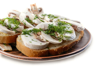 Sandwiches with raw mushrooms champignon and dill on a plate, white isolated background