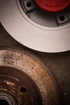 Car worn and rusty brake disk and a new one
