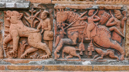 Detail of hunting scene with horse and lion intricate terracotta carving at Kantaji aka Kantajew medieval hindu temple in Kantanagar, Dinajpur, Bangladesh