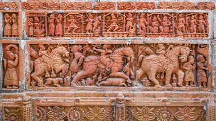Beautiful terracotta carving scenes of Ramayana (top) and hunting party (bottom) at Kantaji aka Kantajew medieval hindu temple in Kantanagar, Dinajpur district, Bangladesh