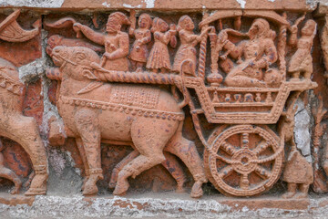 Detail of man with hookah on ox cart intricate terracotta carving at Kantaji aka Kantajew medieval hindu temple in Kantanagar, Dinajpur, Bangladesh
