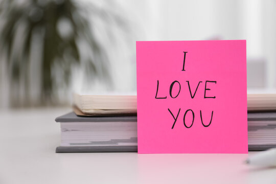 Memory sticker with phrase I Love You at table, space for text. Valentine's Day celebration