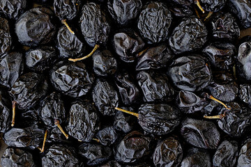 close-up topview photo of dried dark grapes as a background