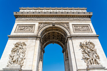 Fototapeta na wymiar The Arc de Triomphe de l'Étoile,Triumphal Arch of the Star, one of the most famous monuments in Paris, France, at the western end of the Champs-Élysées at the centre of Place Charles de Gaulle