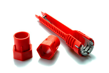 Pipe wrench, Multifunctional tool for common faucet installations and sink strainers over white background.