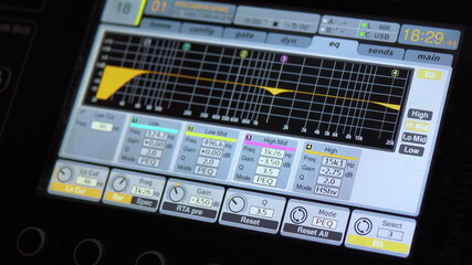 Sound tuning on a professional electronic mixer. Control panel for tuning sound channels. Monitor electronic mixer. Close-up.