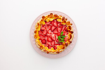 .Beautiful strawberry gift pie on a plate with a spatula