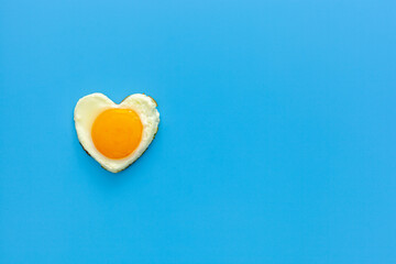 Fototapeta na wymiar a heart shaped chicken egg