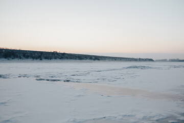 Landscape with frozen water, ice and snow on the  river during winter.