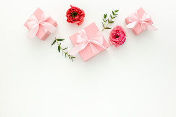 Valentines day composition: pink gift boxes with ribbon, heart and rose