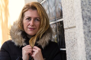 portrait of woman with anorak in winter © tetxu