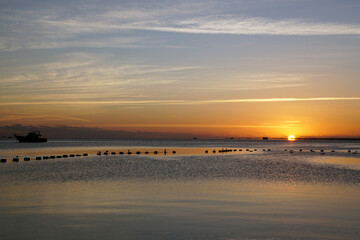 Fototapeta na wymiar Sunrise on the Red Sea in Hurghada. Bright sun and reflection on the water