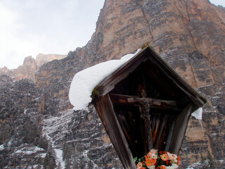 a wayside cross with jesus christ in winter