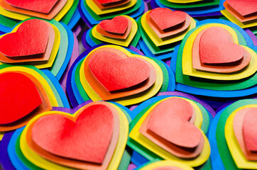 Fun colorful lgbt valentine's day abstract background - rainbow valentines hearts, pattern, top view.