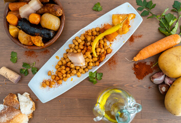 spanish traditional food cocido with chickpea and chorizo black pudding chickpeas bacon carrot...