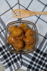 Cilok is balls prepared with a base of tapioca flour. Whether boiled or fried, cilok balls are typically accompanied by a sweet peanut sauce or spicy sauces based on ketchup and kecap manis. 