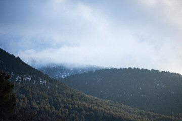 mountains with snow and fog