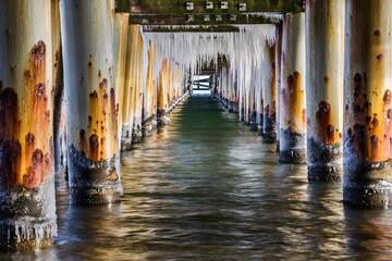 Pier by the sea, icicles, beautiful winter landscape
