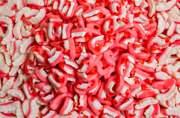 Red white sweet jelly teeth candies background