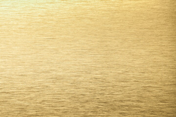 Golden aluminum texture background. Yellow stainless texture metal backdrop.