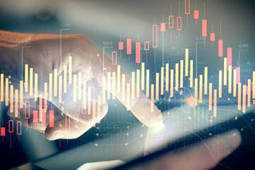 Multi exposure of man's hands holding and using a phone and financial chart drawing. Market analysis concept.