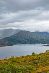 Naklejka na ściany i meble Fjord landscape with extrem weather conditions
