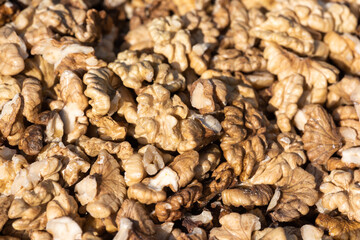Heap of open walnuts on a market stall in Chengdu, Sichuan province, China