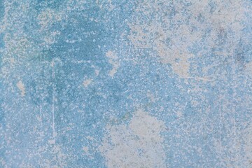 Old cement wall painted in light blue vintage texture and background