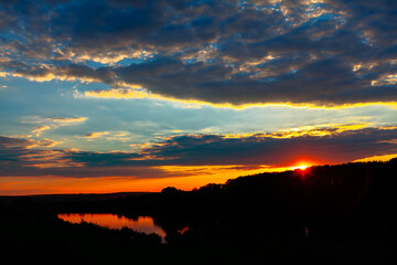 Scenery of the breathtaking sunset reflecting in the lake
