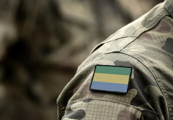 Flag of Gabon on military uniform. Army, troops, soldiers, Africa,(collage).