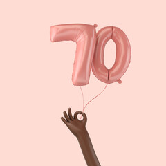 Hand holding a 70th birthday pink foil celebration balloon. 3D Rendering