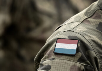 Flag of Luxembourg on military uniform. Army, troops, soldiers. Collage.