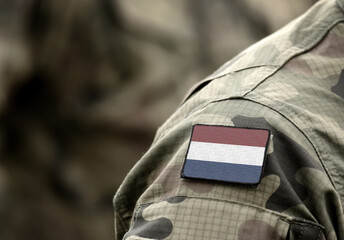 Flag of Netherlands on military uniform. (collage).