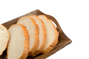 Slices of sliced bread lie in a wooden bread box.Isolated white background. Top view with copy space.