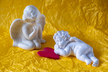 angel sitting and angel sleeping on the heart