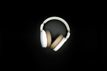 Fototapeta na wymiar headphones on black background. music concept. flat lay flat design. copy space