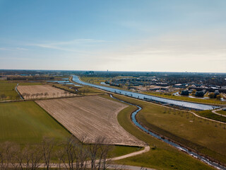 Aerial drone shot of the flat landscape of the Netherlands.
