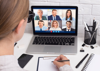 Businesswoman Having Virtual Meeting Via Video Call Sitting At Workplace