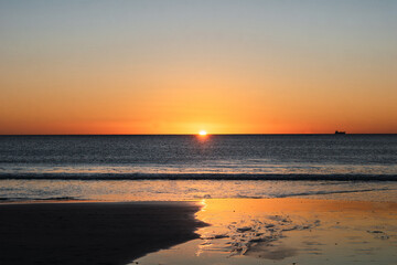 Last moment of the sun setting at sunset over the sea