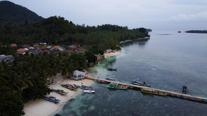 Pier with at Lampung Sea Pahawang Beach, located near the Sumatera city aerial drone. Resort Pahawang With a clouds on the Sky in a day.