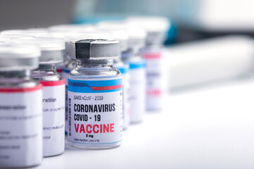 virus vaccine development of a coronavirus COVID-19, vaccine bottle in concept of insurance and fight against coronavirus 2019 ncov cure, medical research in laboratory to stop the spread of the virus