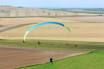 Paraglider flying at Milk Hill, Wiltshire