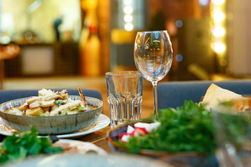Served table set at restaraunt in the evening
