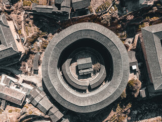 Aerial view of a village with Tulou, a traditional Chinese architecture in Fujian province, China.