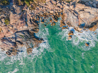Aerial view of the coastline with rocks.